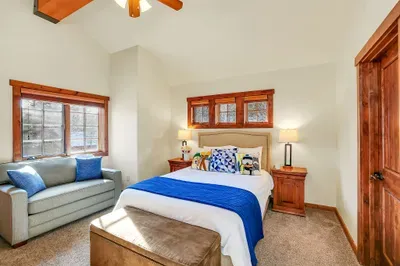 The upper queen bedroom gives couples, friends, or older kids their own private landing zone away from the main living spaces. Also features a twin pull-out sleeper