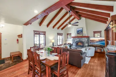 Sink into the sofa by the fire while someone stirs a pot on the stove—this is the heart of First Tracks + Fairways