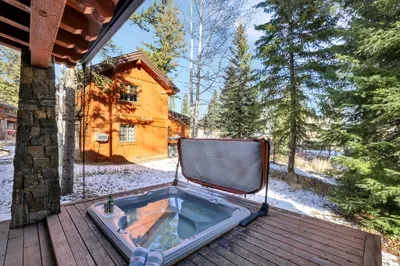 With the hot tub, Weber grill, and seating all within a few steps, the patio becomes your all‑in‑one après zone