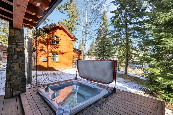 With the hot tub, Weber grill, and seating all within a few steps, the patio becomes your all‑in‑one après zone