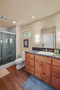 The 2nd floor suite has a private bathroom with plenty of storage and ample counter space