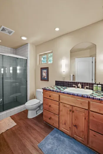 The 2nd floor suite has a private bathroom with plenty of storage and ample counter space