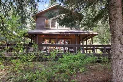 Let's explore The Outpost's outdoor space--we can't get enough of this expansive deck! The trail to the beach is located just behind the property...