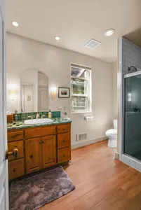 The main floor bathroom is shared with the rest of the home, and is also connected to the main floor bedroom