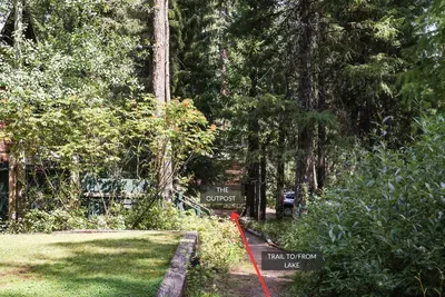 The dirt trail is public access, and takes you to stairs that lead down to the beach and dock