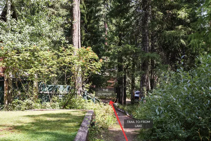 The dirt trail is public access, and takes you to stairs that lead down to the beach and dock