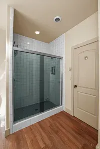 The main floor bath offers a spacious walk-in tiled shower