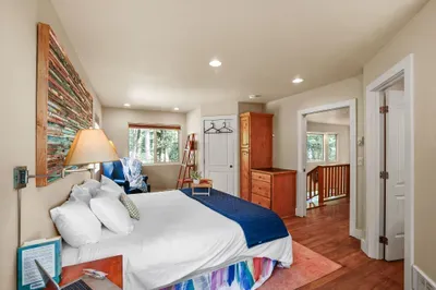 This ensuite is exceptionally spacious and also offers a king-sized bed, AC, + a private ensuite bath. The walk-in closet is locked-off to guests, but hooks and hangers are provided--there's also a good deal of space in the built-in dressers