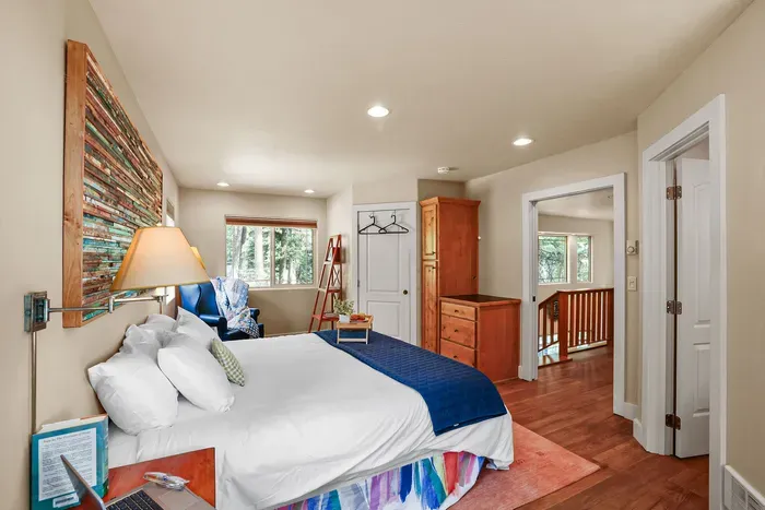 This ensuite is exceptionally spacious and also offers a king-sized bed, AC, + a private ensuite bath. The walk-in closet is locked-off to guests, but hooks and hangers are provided--there's also a good deal of space in the built-in dressers