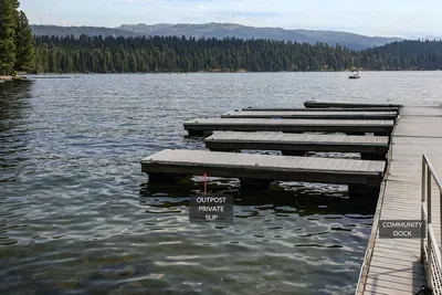 McCall at its finest! Stunning mountain backdrops surround Payette Lake, and with your own private boat slip it feels like your own private paradise