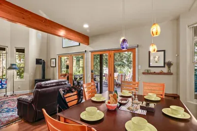 The Outpost offers both indoor and outdoor dining--the indoor dining table seats 8 and the patio dining table seats 6. Quick deck access adds awesome bonus square footage in the warmer months