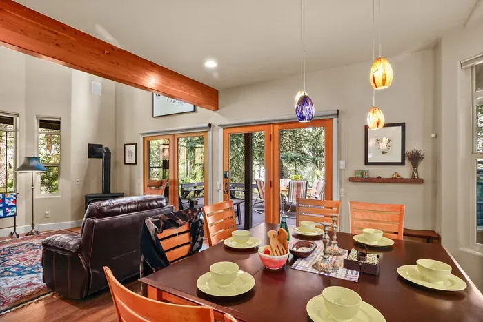 The Outpost offers both indoor and outdoor dining--the indoor dining table seats 8 and the patio dining table seats 6. Quick deck access adds awesome bonus square footage in the warmer months
