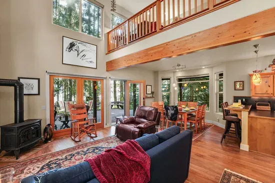 Welcome! Enjoy the inviting open layout of the main living space, where natural light and cozy comforts create the perfect getaway backdrop