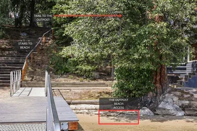 From the dirt trail, take the steps down to the community dock and beach. The Outpost has a 10' section of beach access (the other 10' to the south belong to a neighboring property), as well as your private boat slip