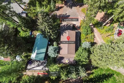 There's parking space for up to 3 vehicles (or 2 vehicles and a trailer). Behind the home is the dirt trail to Payette Lake access, which is a short 1 minute walk away. Charlie's Garden can also be accessed this way
