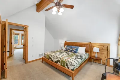 Drift off in a true king bed after a day on the mountain or on the lake