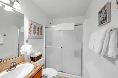 Downstairs bath with walk-in shower—easy access from the backyard