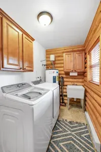 The spacious laundry room and mudroom, equipped with full-sized Samsung washer/dryer, make it easy to keep your adventure gear fresh and ready