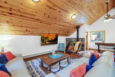 Movie Night Magic: Grab some popcorn and get comfy in front of the massive 75" TV in the bonus room. With the cozy warmth of the wood stove nearby, it's the ultimate setup for a perfect movie night