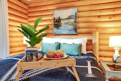 Unwind in the main floor's queen bedroom, where comfort meets convenience, making it a perfect spot for restful nights after a day of adventure