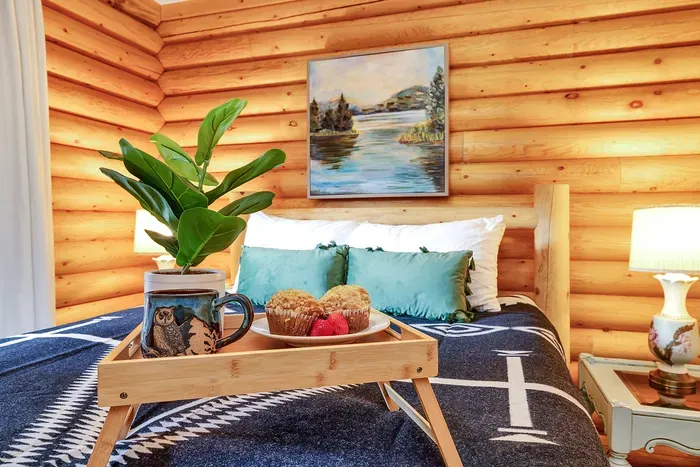 Unwind in the main floor's queen bedroom, where comfort meets convenience, making it a perfect spot for restful nights after a day of adventure