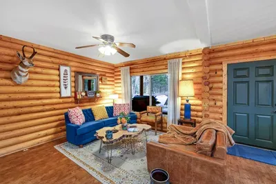 Snuggle up in the inviting living room, where the warmth of the wood stove set the perfect scene for relaxing evenings with family and friends (firewood provided!)
