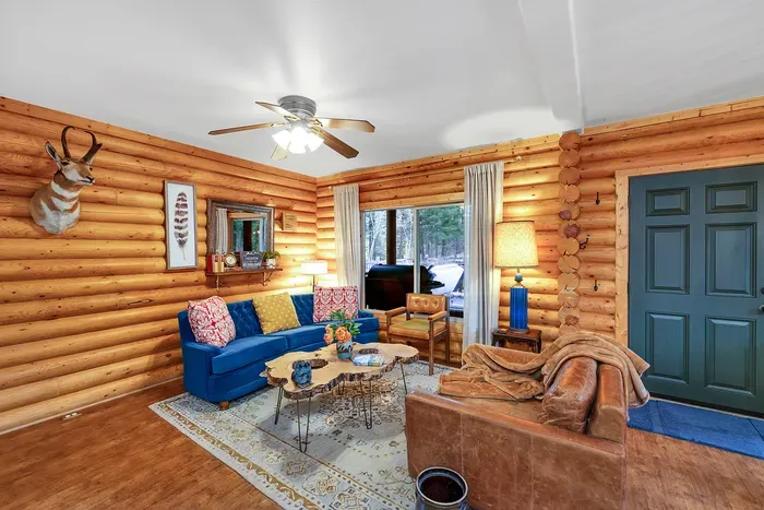 Snuggle up in the inviting living room, where the warmth of the wood stove set the perfect scene for relaxing evenings with family and friends (firewood provided!)