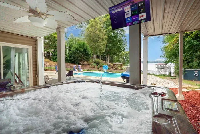 Sit back and soak in the hot tub with views over looking the pool and lake.