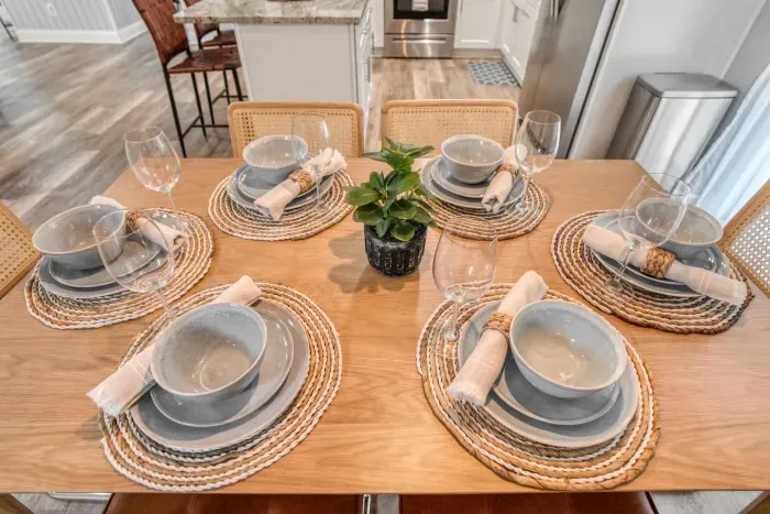 Elegant dining table, chairs and tableware set that accommodates seating for up to 6 people.