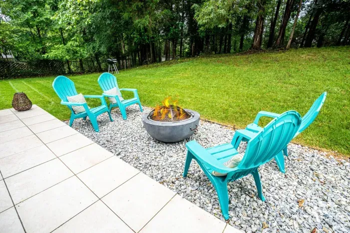 Cozy around the fire pit, sit back, and unwind while enjoying each other's company.