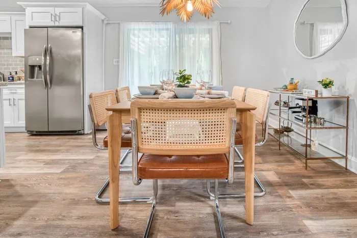 Elegant dining table, chairs and tableware set that accommodates seating for up to 6 people.