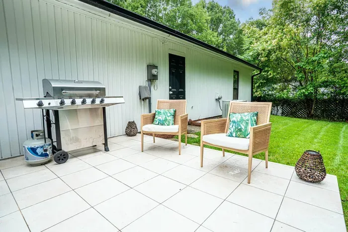 New Charbroil 5-burner gas grill can be used to enjoy a feast while relaxing in the serenity of the fully fenced in backyard.