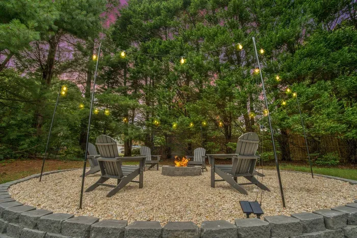 Gather around the fire pit under twinkling string lights—perfect for warm conversations, roasted marshmallows, and peaceful evenings beneath the trees.