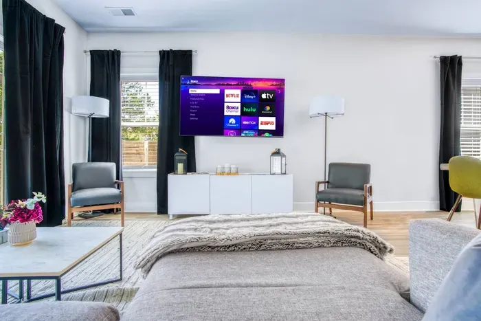 Featuring a large smart TV with streaming access, perfect for relaxing movie nights or binge-watching your favorite shows in style.