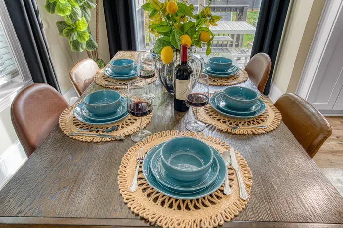 Elegant dining table, chairs and tableware set that accommodates seating for up to 6 people.