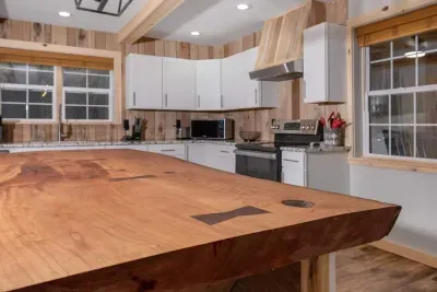 A centerpiece for connection — prep dinner, serve snacks, or play games at this spacious live wood edge island.