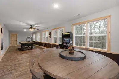 Tucked inside the game room, this cozy, round barrel table is your go-to spot for card games and laughs. 