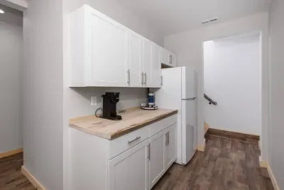 Convenience at your fingertips! Our cozy basement kitchenette features a Keurig coffee maker and a full-size fridge with freezer — perfect for late-night snacks, morning brews, and storing cold and frozen foods during your stay.