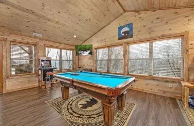 Check out the dreamy game room with pool table and arcades - great family fun all around!