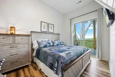 Comfort meets convenience.  This bedroom blends style and function with floating nightstands and a wall-mounted clothes rack (not shown), giving guests extra space and flexibility.