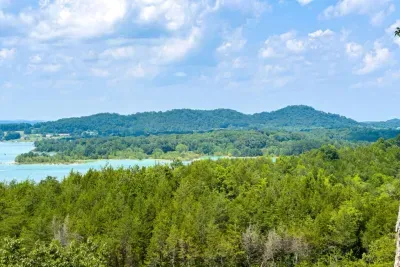 The surrounding Smoky Mountain foothills frame Douglas Lake with layers of green, making every view feel like a postcard.