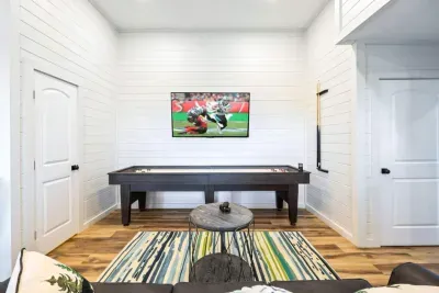 The perfect chill zone.  This is the view from the sofa in the basement hangout—where movie nights, game days, and late-night laughs come together.