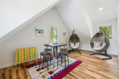The ultimate 3rd-floor hangout!  This loft is designed for fun—colorful rug, pub table, Connect Four, and egg chairs make it the perfect place to gather, unwind, and make memories.
