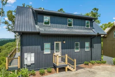 Your visit begins as you enter through the front door, accessed with your own unique door code, leading you into a bright and welcoming cabin retreat.