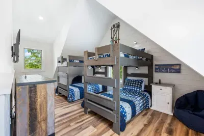 Third-floor bunk retreat and the fourth sleeping area in the house.  Comfortable, stylish, and thoughtfully designed—this bunk room is the perfect place for little adventurers to recharge.