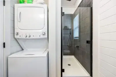 Thoughtful details make all the difference.  A convenient combo washer/dryer located right in the primary suite for effortless stays.