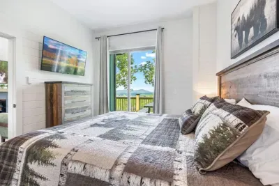 Unwind in the master king suite with soft, luxurious bedding, a 43" Smart TV, and a stunning mountainous view just steps from your door.