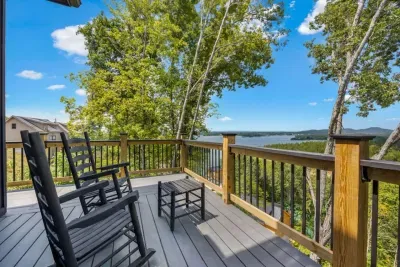 A view guests rave about.  This main-level balcony offers a serene escape with scenic water views—and a Weber grill is provided on the deck for cookouts and family dinners.