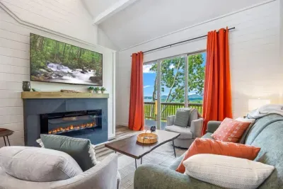 Welcome to your lake escape at Whatever Floats Your Boat!  Step into a bright, cozy living space where panoramic views, a warm fire, and calm, airy comfort set the tone for an unforgettable stay.