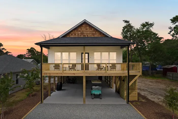 Welcome to your Oak Island escape at Seaglass Scapes! Relax on the spacious covered deck, soak in the coastal breeze, and cruise the island in style with our optional golf cart rental.